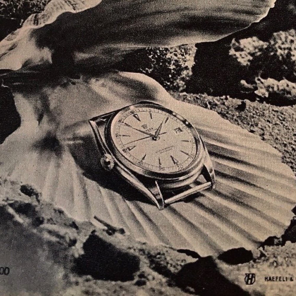 pubblicità vintage con Rolex datejust a sinistra