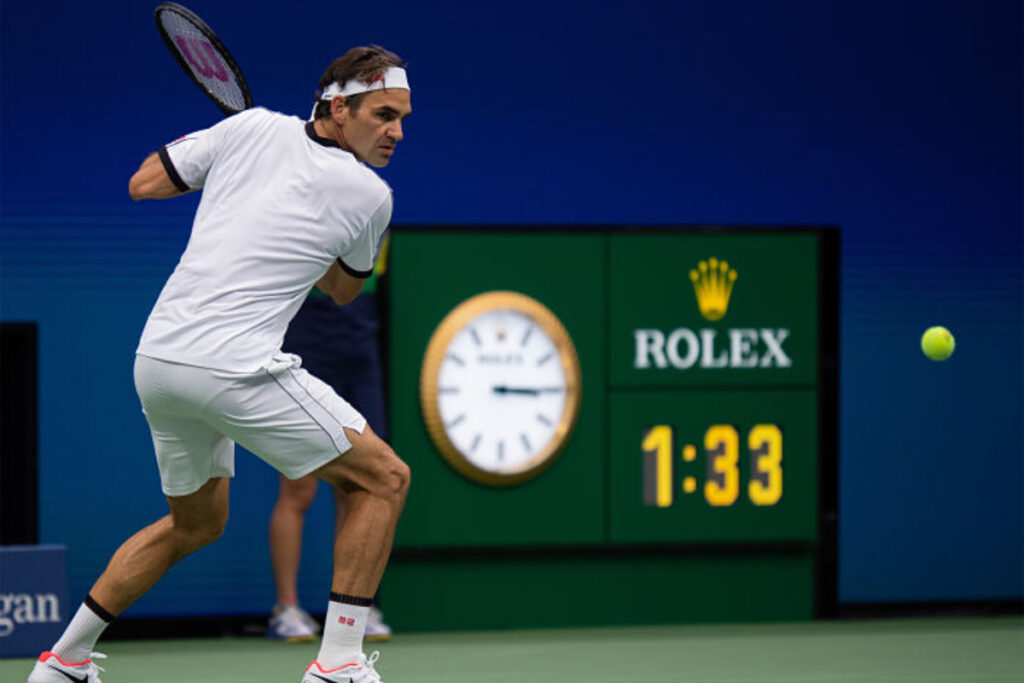 tennis champion Roger Federer playing a backhand