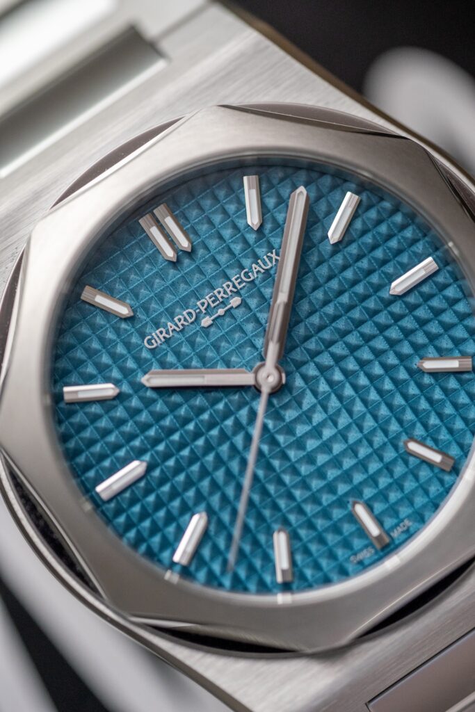 Detail of the blue enameled Clous de Paris dial of the Girard-Perregaux Laureato Fifty 39 mm