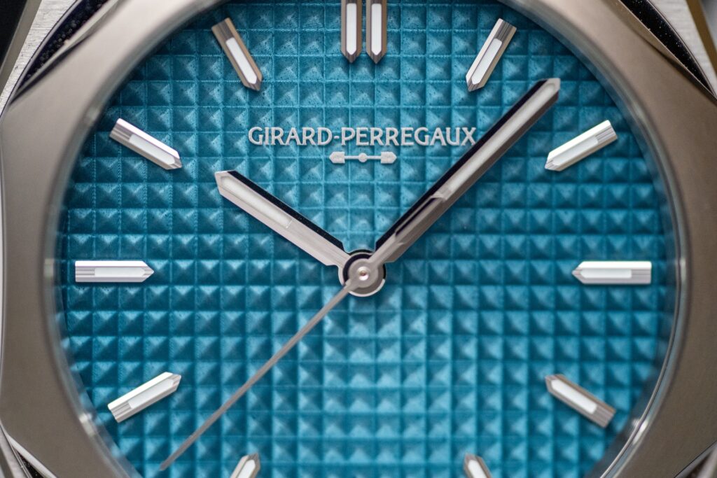 Detail of the blue enameled Clous de Paris dial of the Girard-Perregaux Laureato Fifty 39 mm